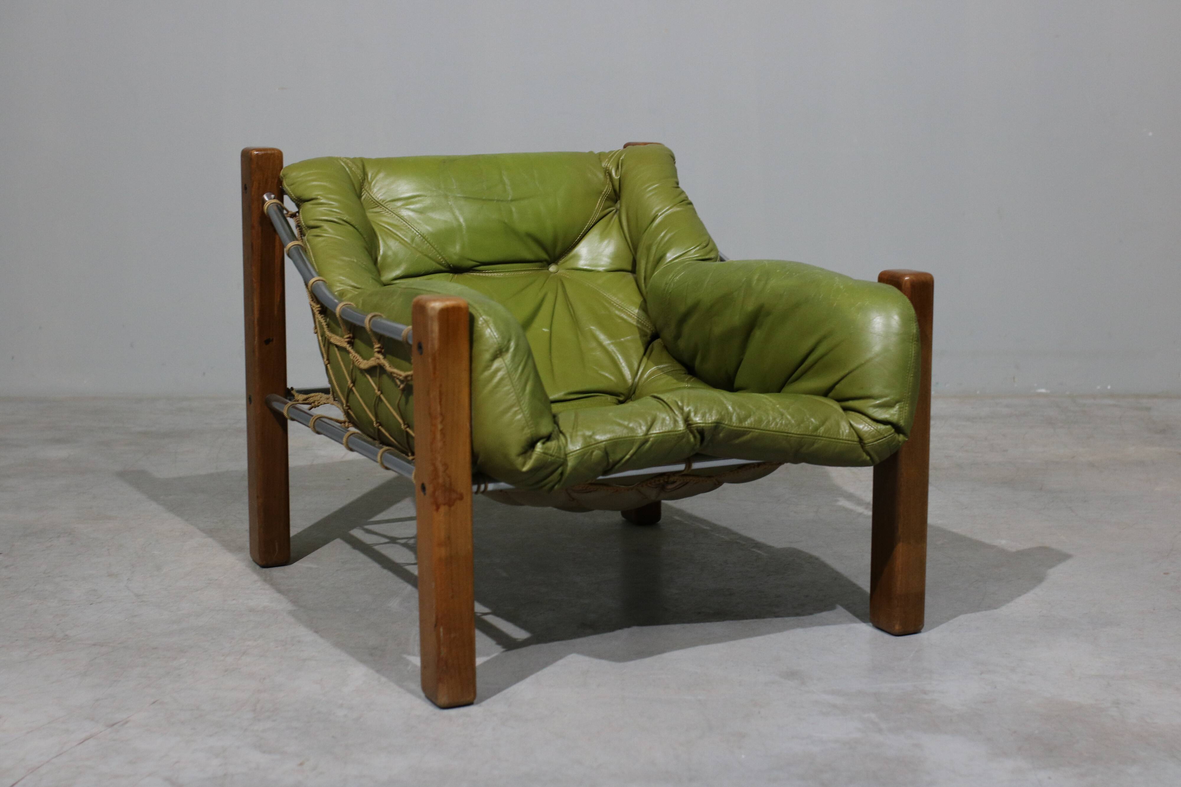 Leather Armchair and Ottoman by Jean Gillon