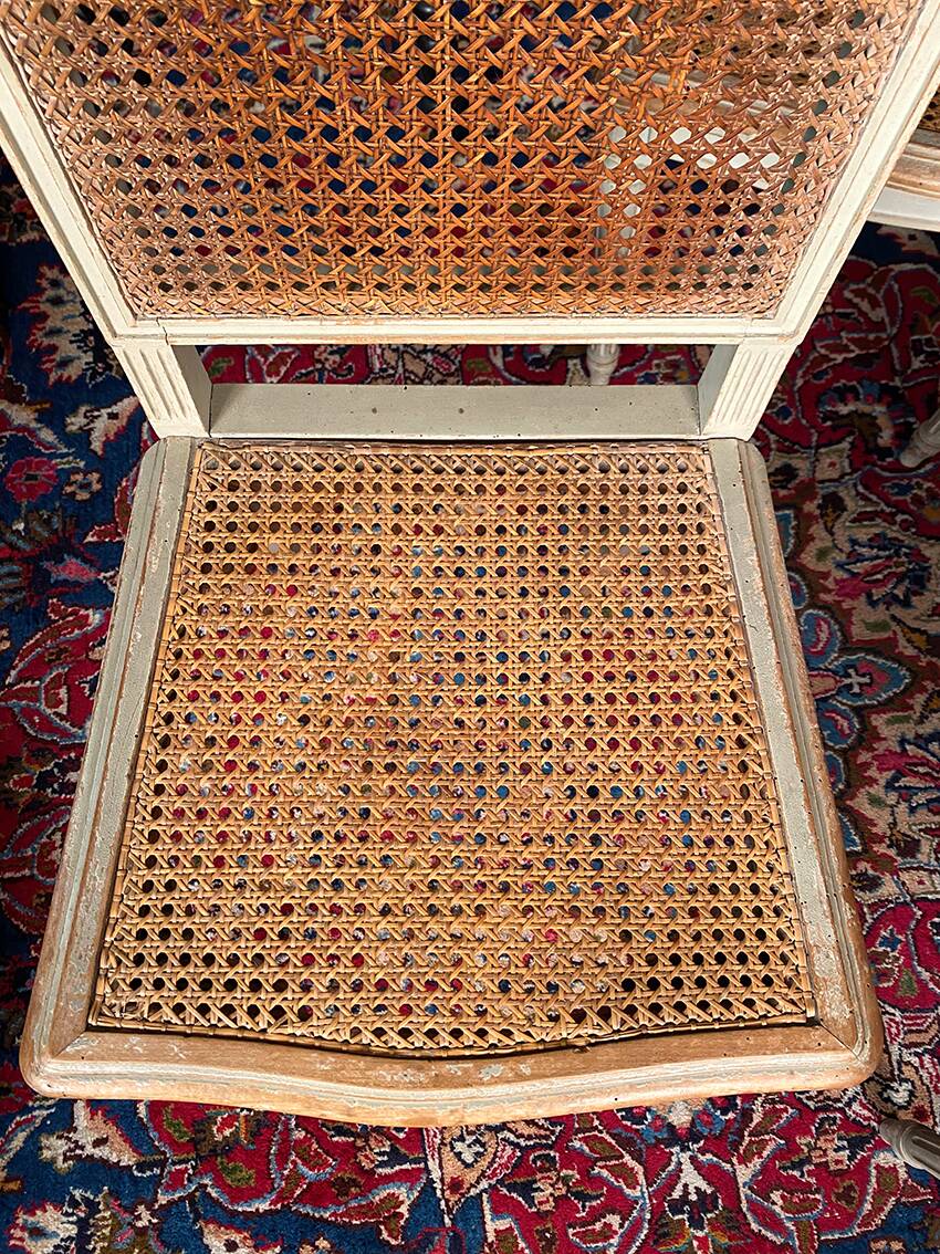 Set of four grey lacquered wooden chairs in the Louis XVI style, late 19th century.
