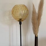 Table lamp with an antique vintage gold globe, mounted on a gold base