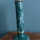 Column candle holder in ceramic with green and gold marble effect.