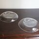 Hermès pair of glass plates with a dolphin pattern.
