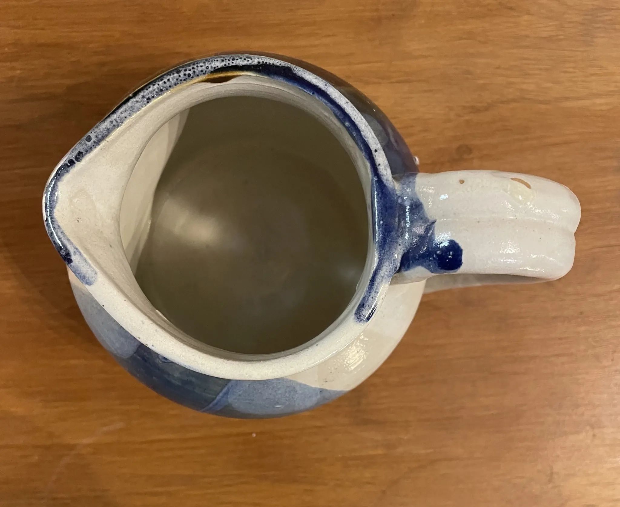 Beige and blue stoneware jug
