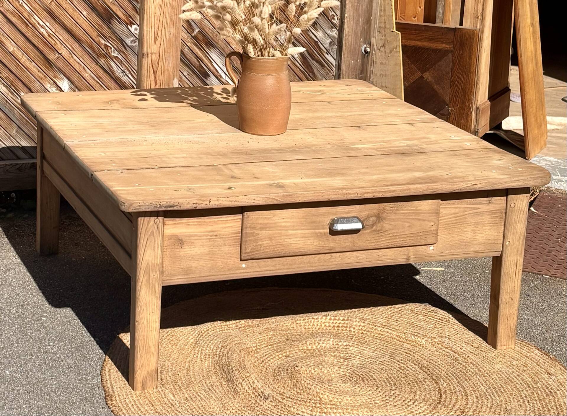 Large square farmhouse coffee table made of raw solid oak.