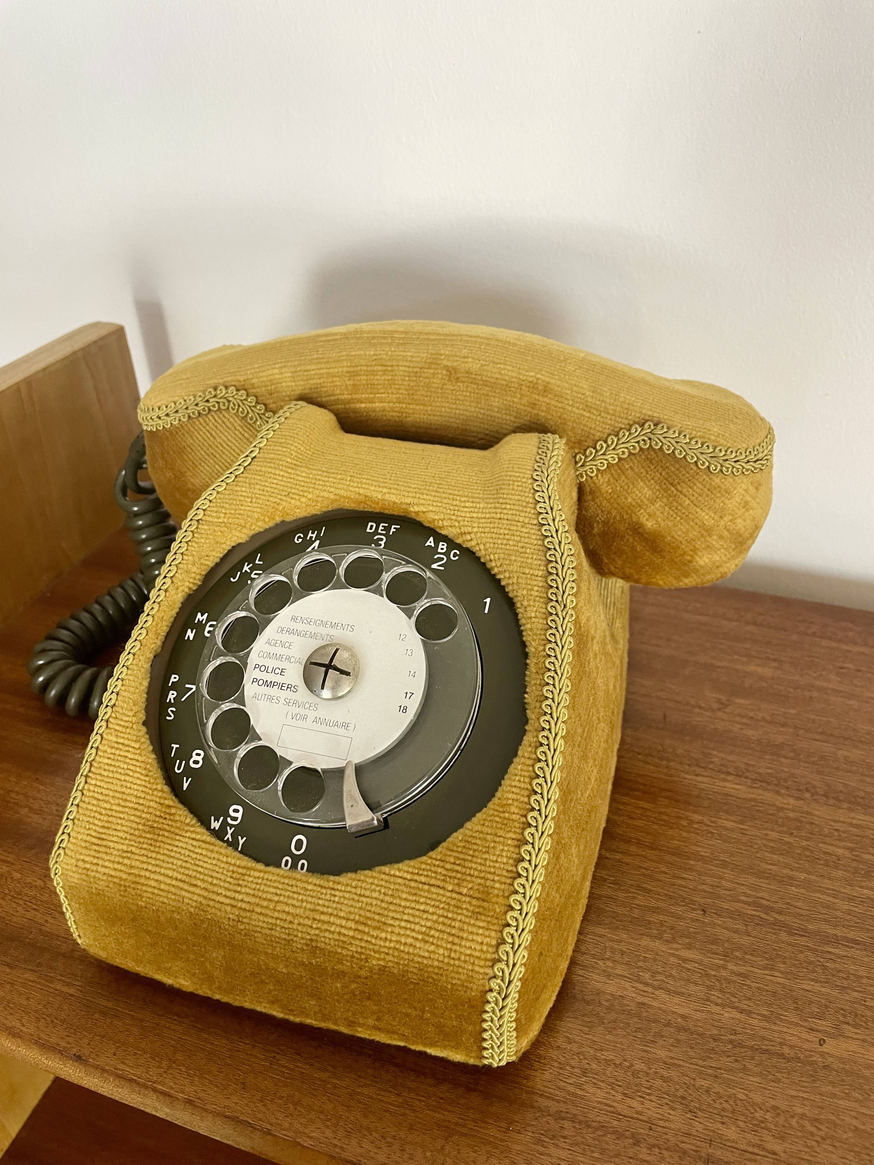 Socotel S63 telephone with its gold velvet shell