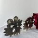 Pair of metal flower candlesticks