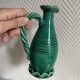 Small green ceramic pitcher