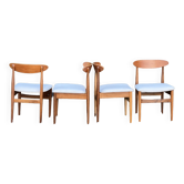 A set of GPlan chairs in teak with a white woolly fabric