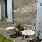 Duo of wrought iron armchairs