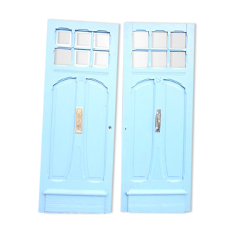 Double front door, fir and windows at the top
