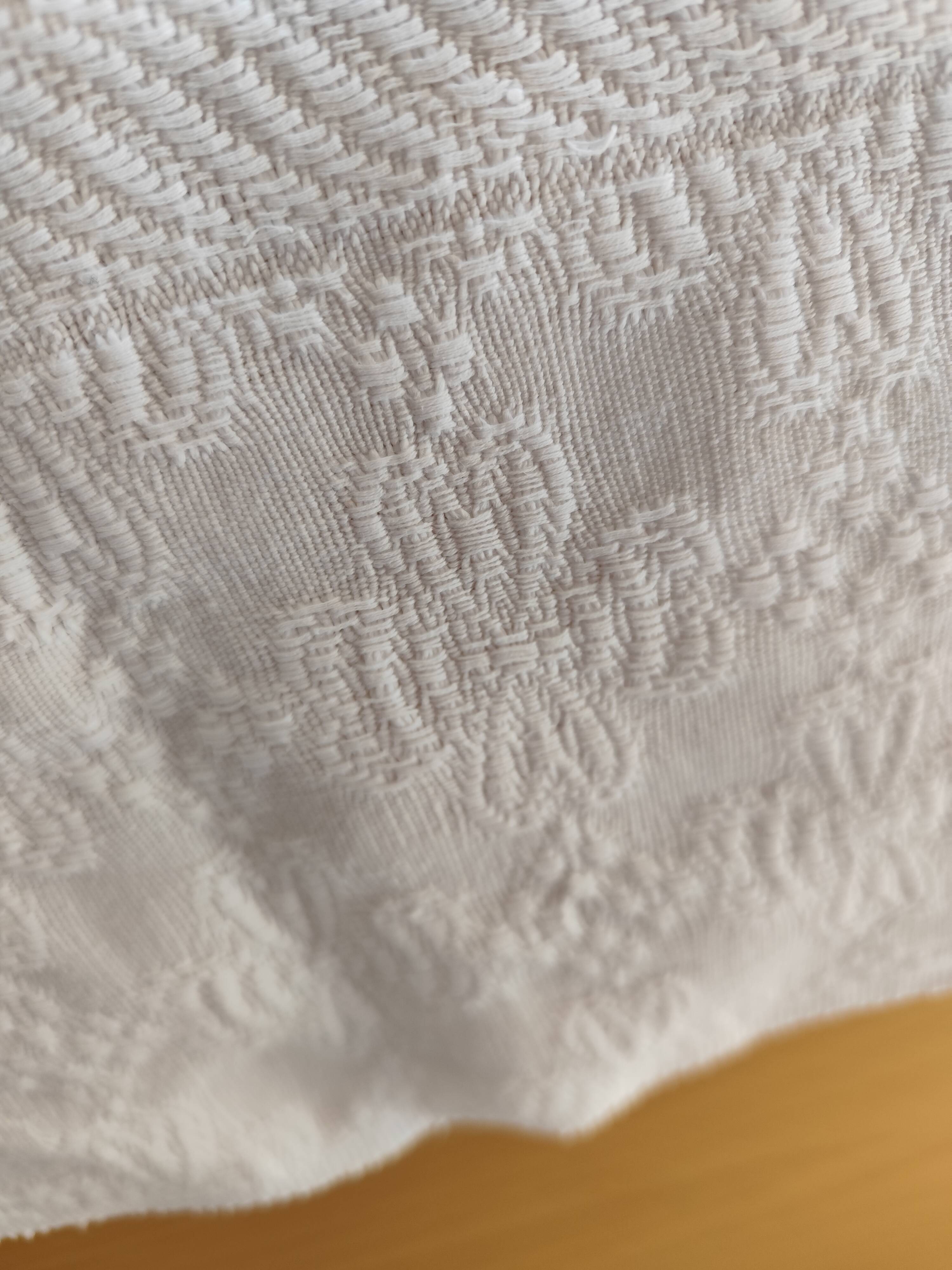 White woven cotton bedspread with fringes