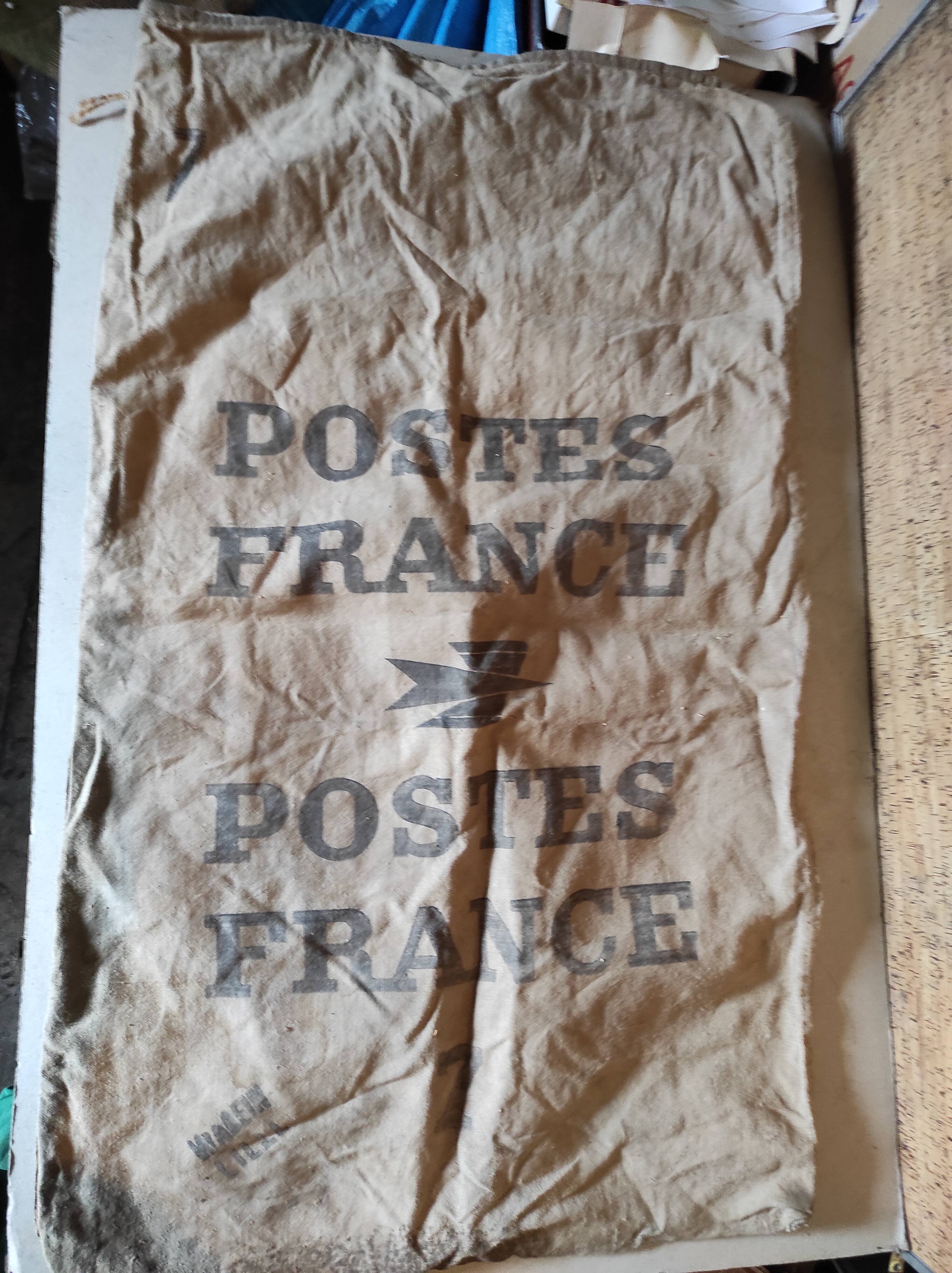 Vintage postal bag trade object of La Poste in mixed-race canvas burlap