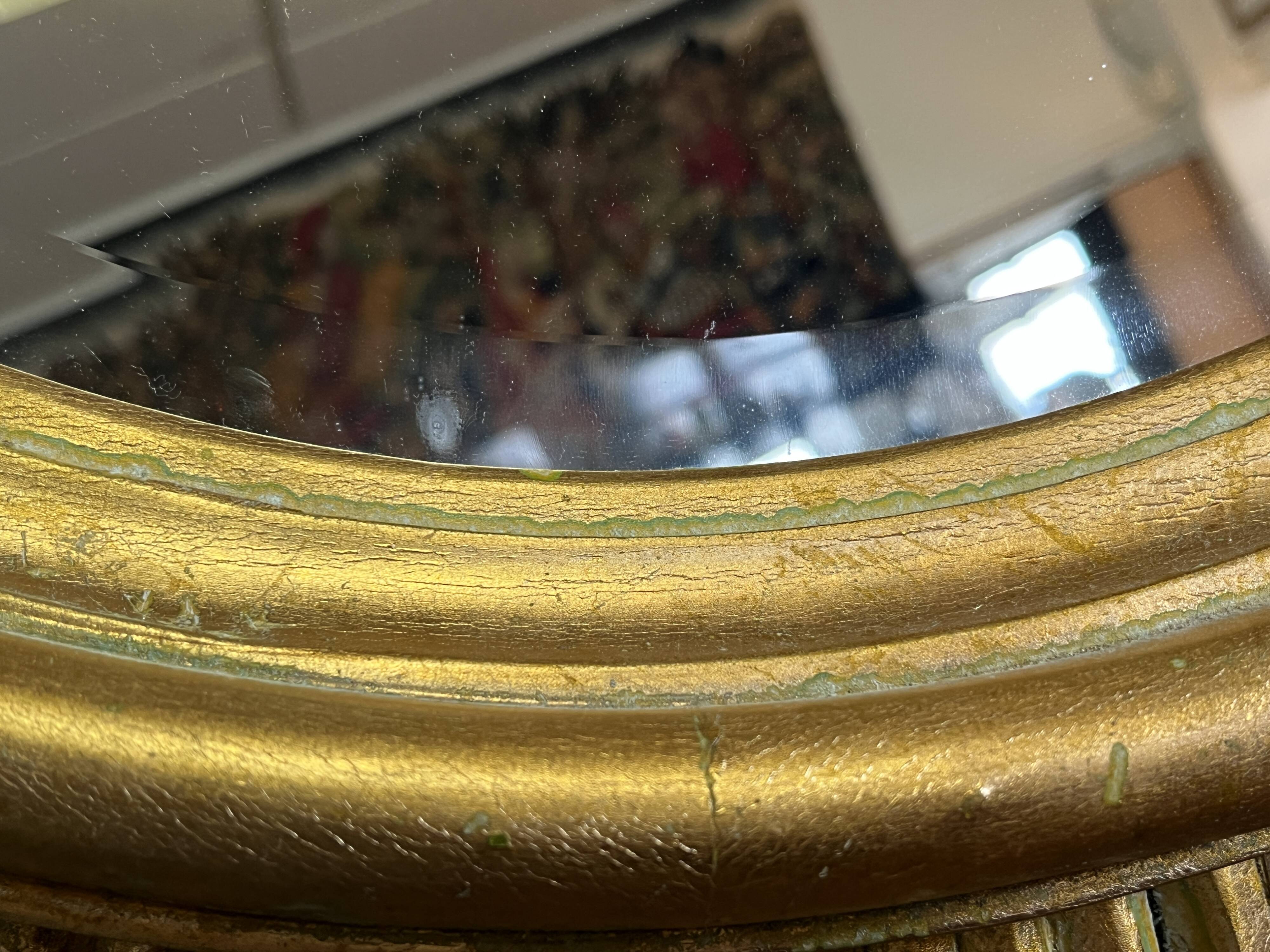Large sunburst mirror with beveled glass and gilded wood from around 2010.