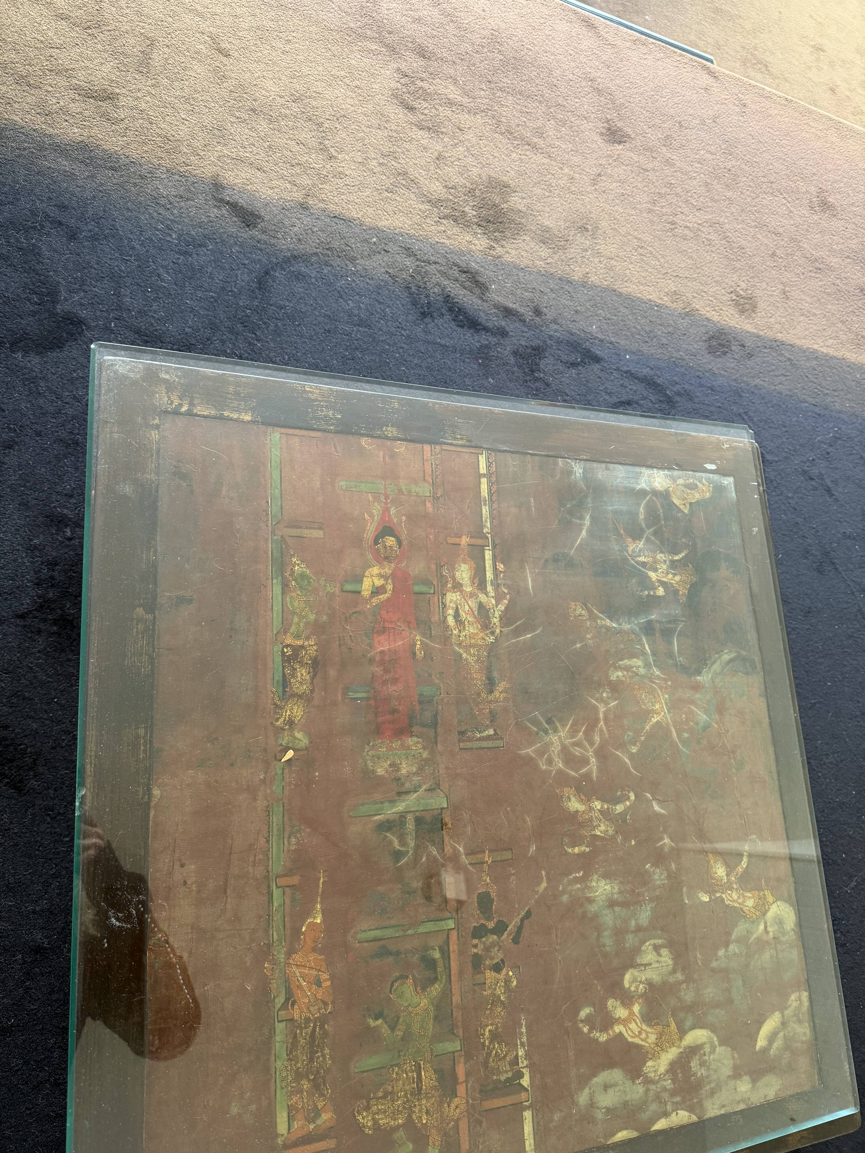 Vintage brutalist coffee table with Asian decor.
