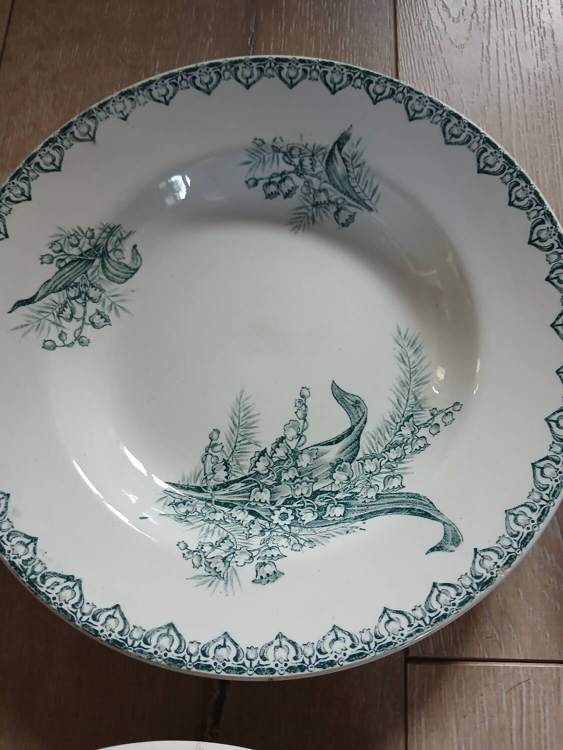 4 Terre de fer soup plates with lily of the valley motifs