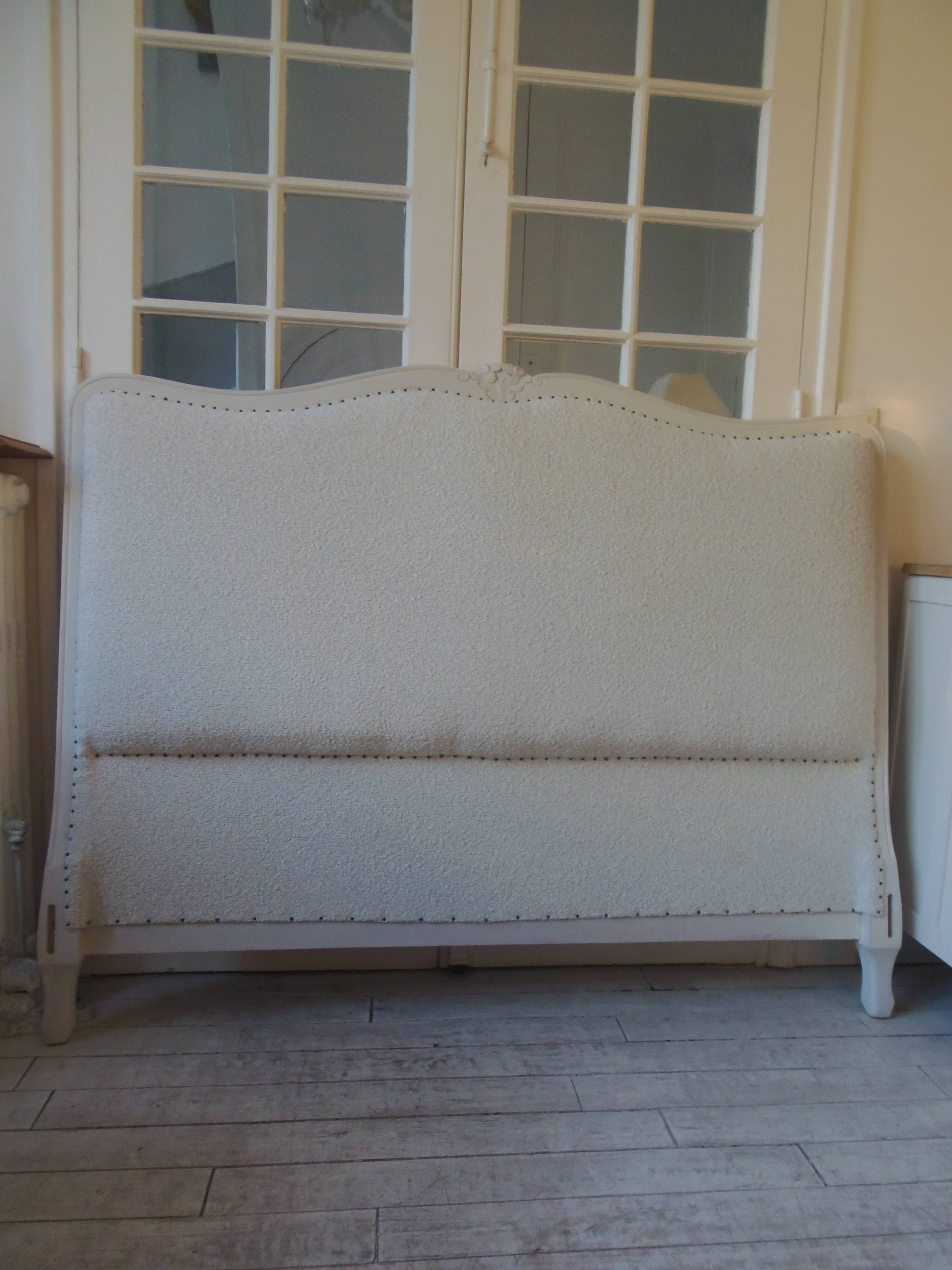 Louis XV style headboard with pearl grey patina, upholstered in off-white bouclette.