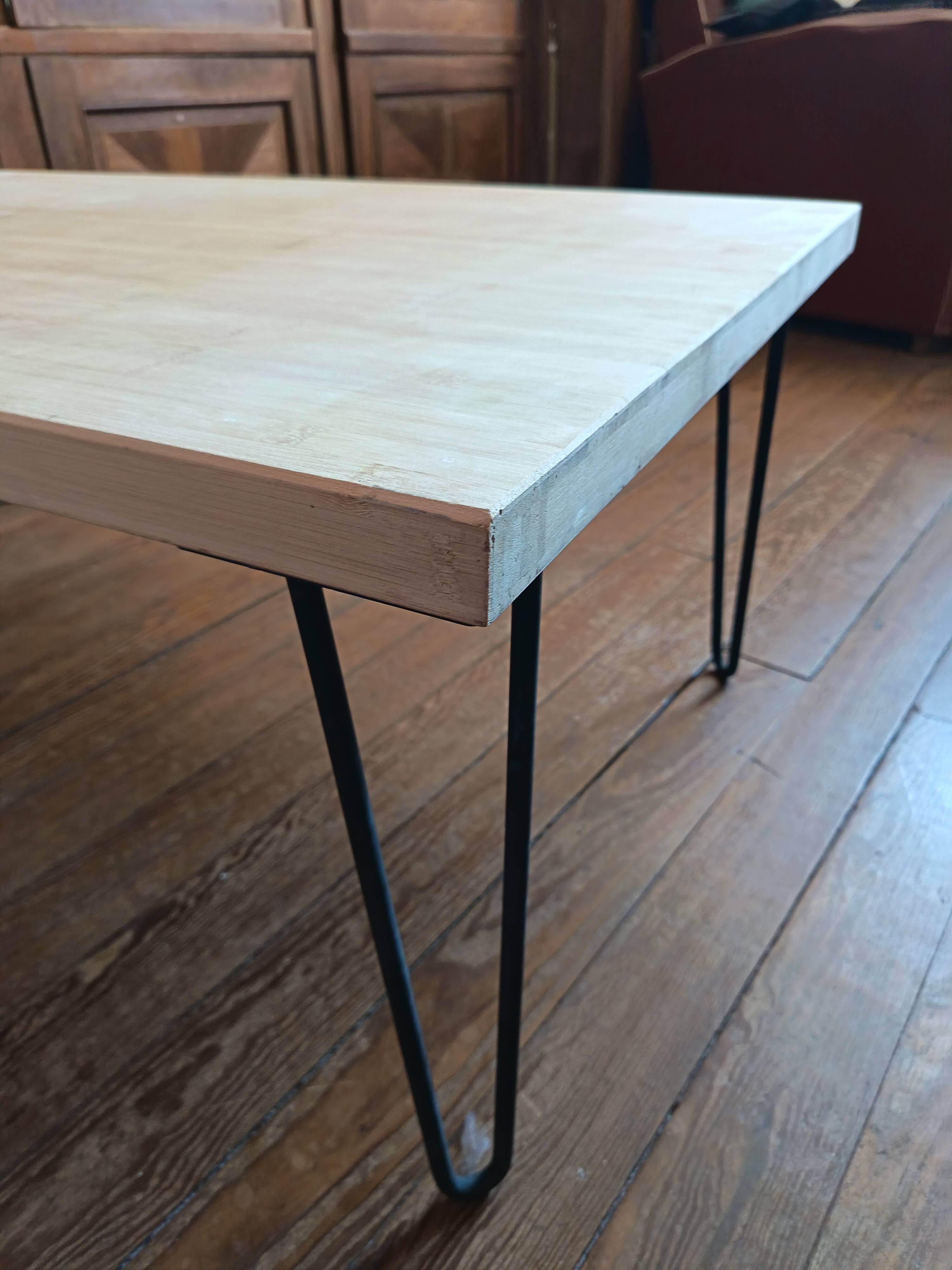 Coffee table in solid bamboo with steel legs.
