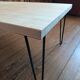Coffee table in solid bamboo with steel legs.