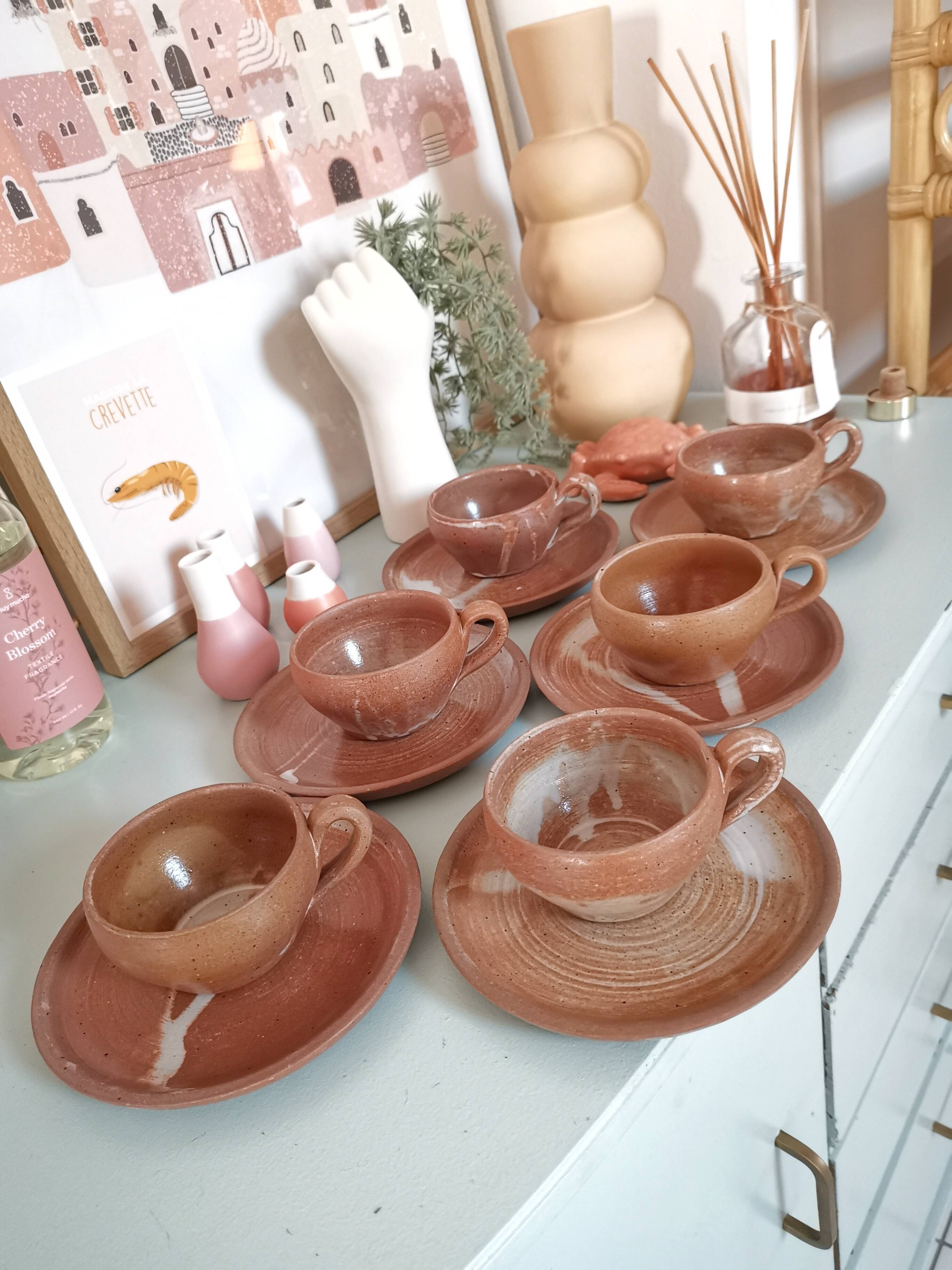 Set of vintage stoneware cups and saucers