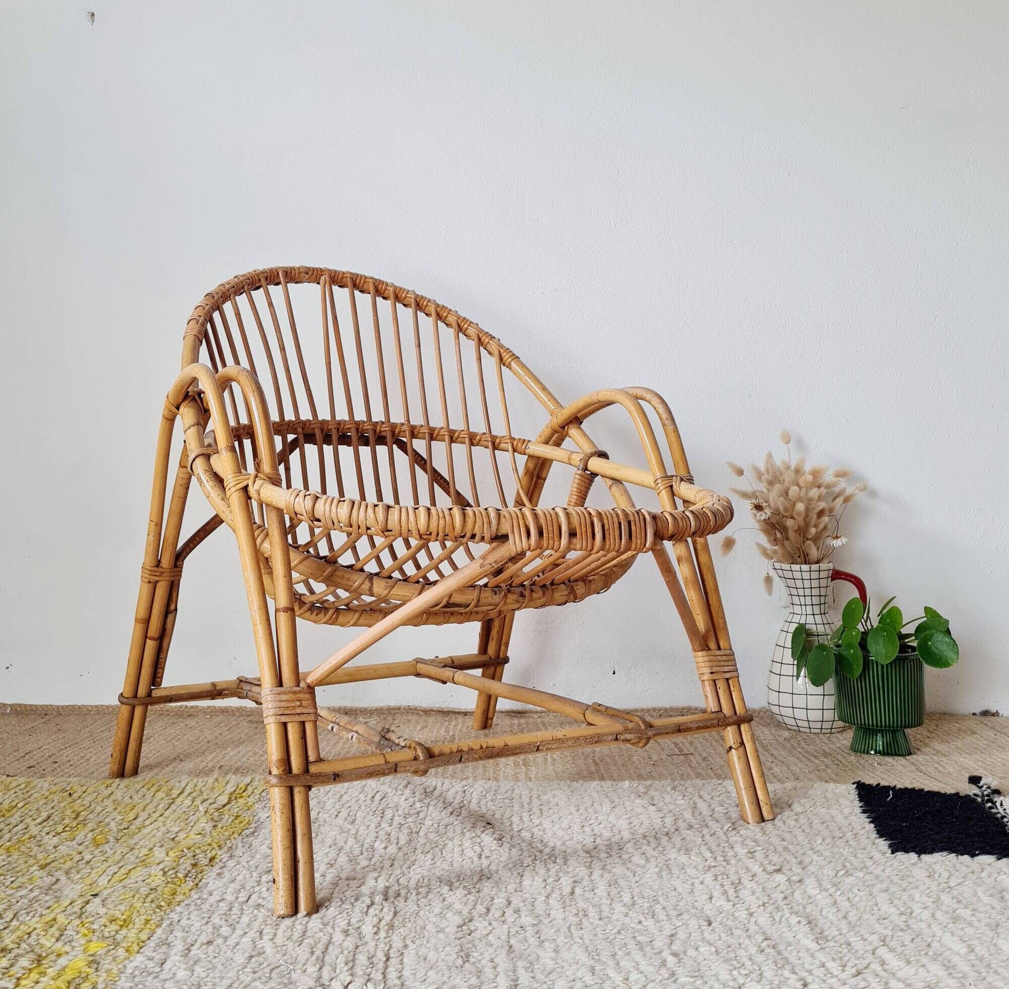 Vintage adult rattan armchair from the 1960s.