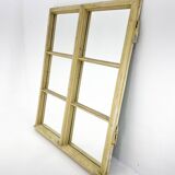 Vintage wooden window converted to a mirror