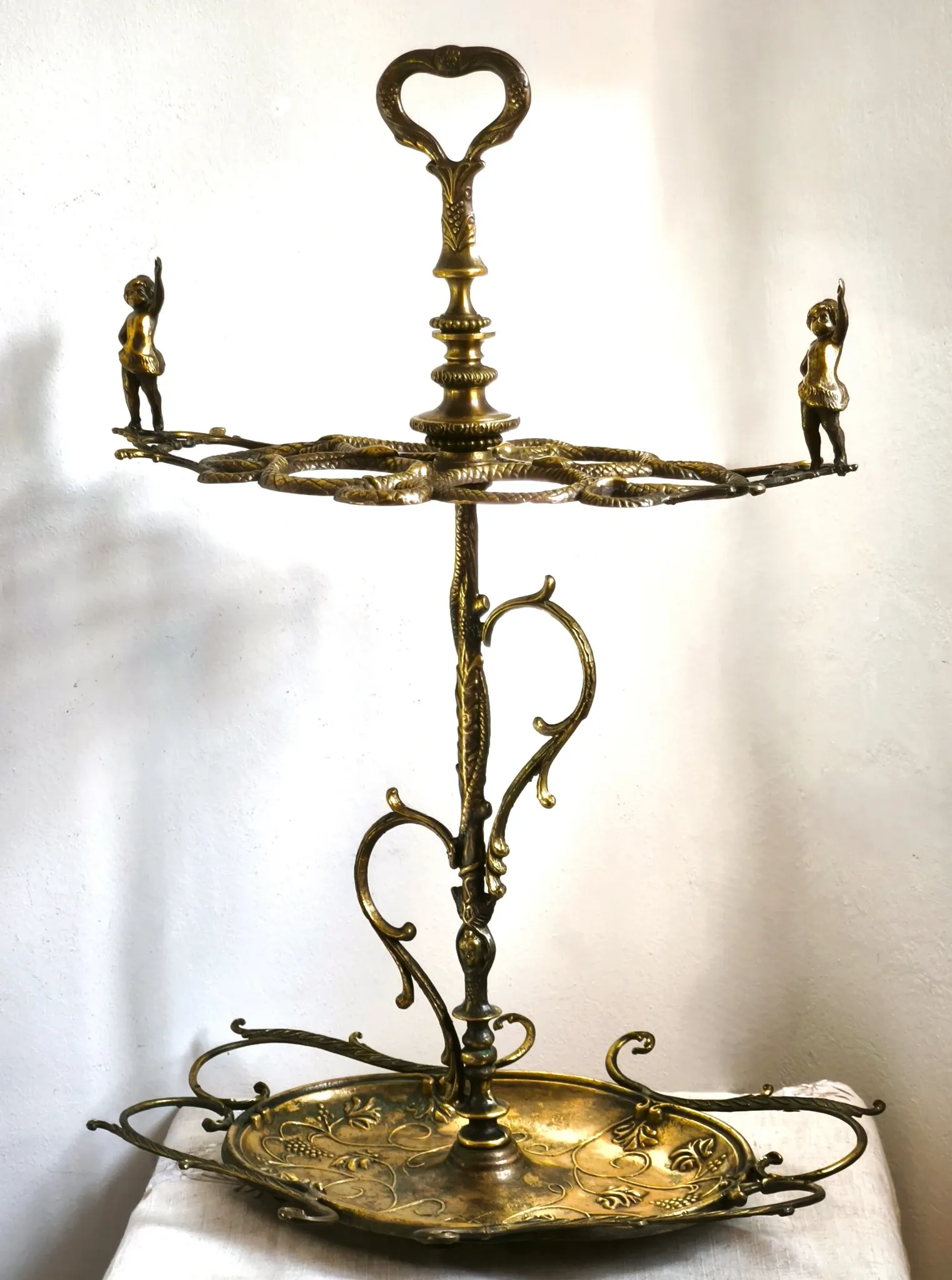 Italian brass umbrella stand, Art Nouveau style, with putti.