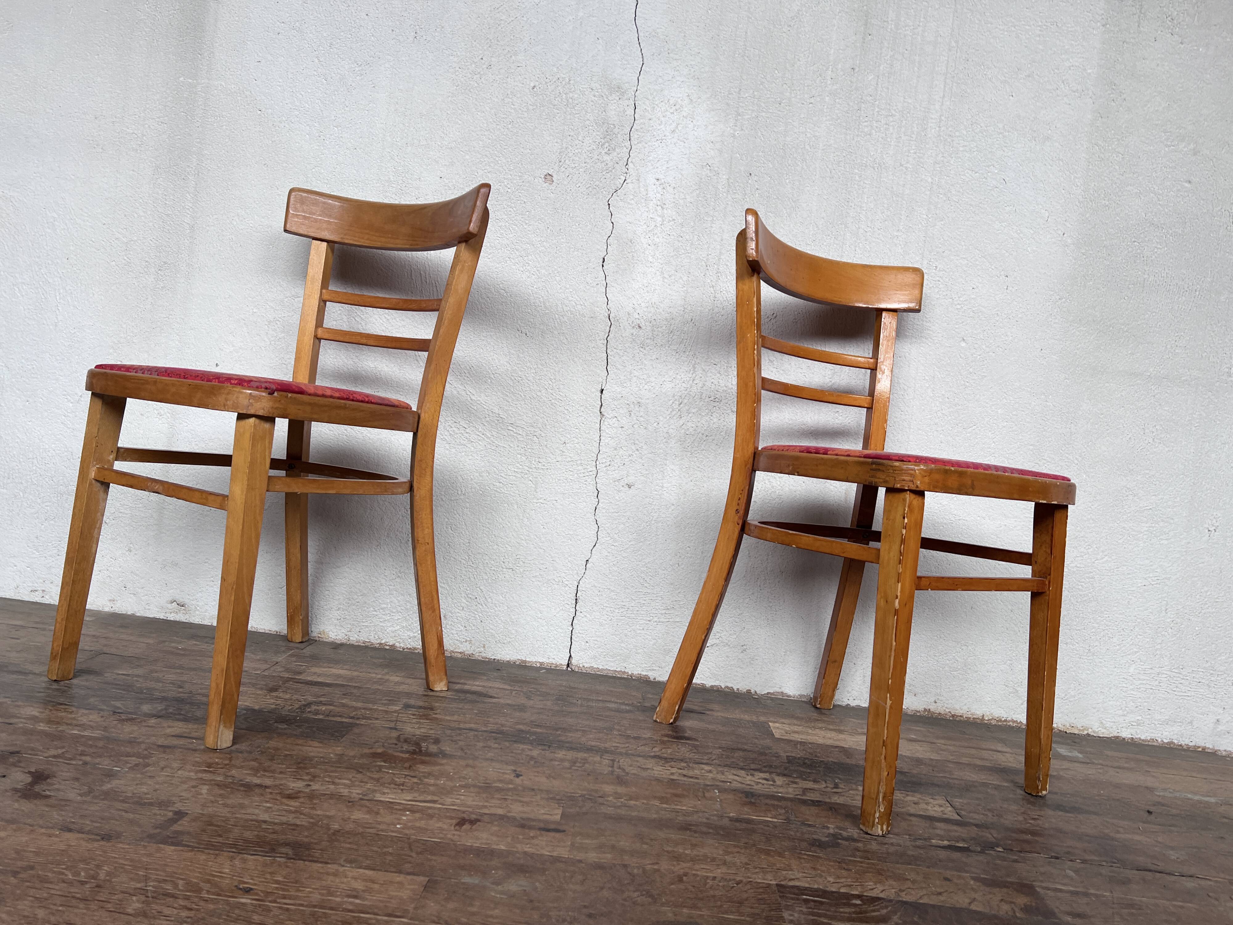 Pair of chairs in light wood and vintage red fabric 1960