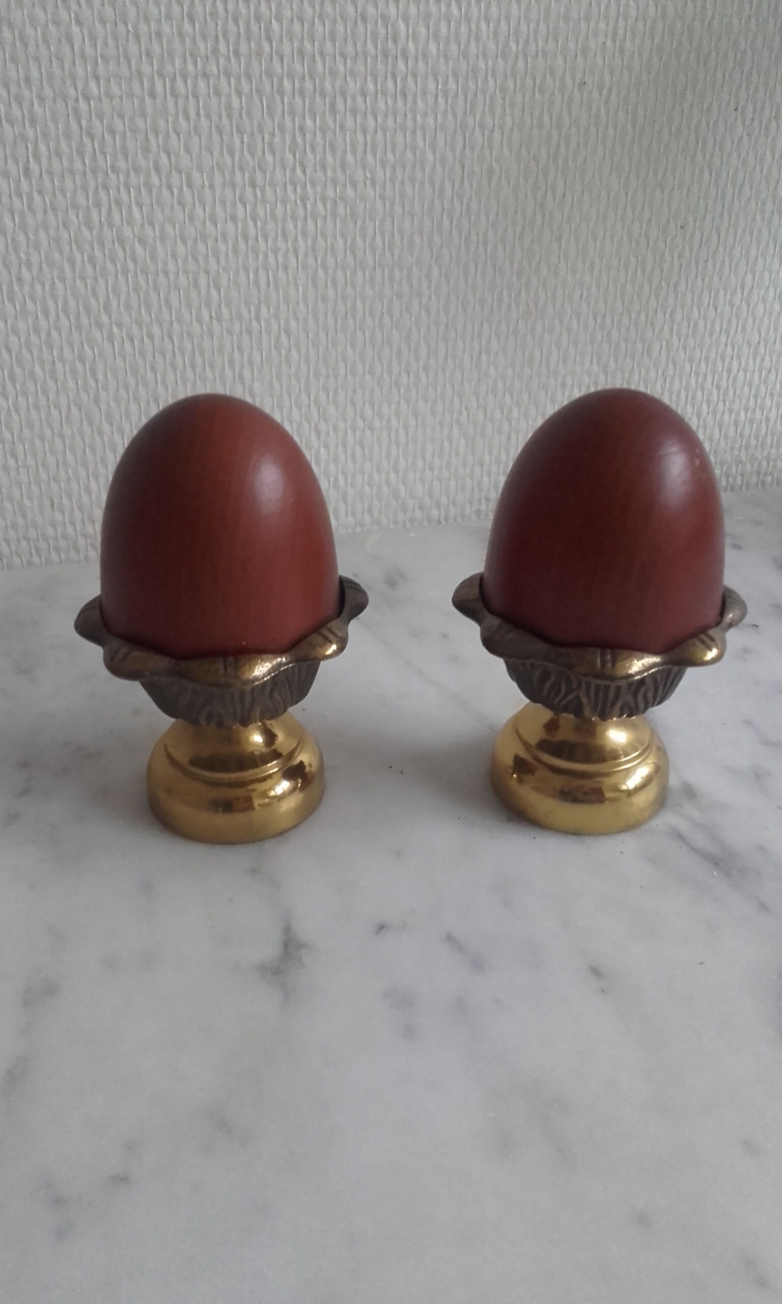 Pair of brass cockroaches with wooden eggs