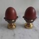Pair of brass cockroaches with wooden eggs