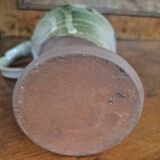 Enameled stoneware pitcher signed