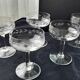 8 vintage glass champagne coupes with an engraved frieze decoration.