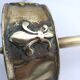 Ashtray on foot. Bronze and brass, with fleur-de-lis decoration.