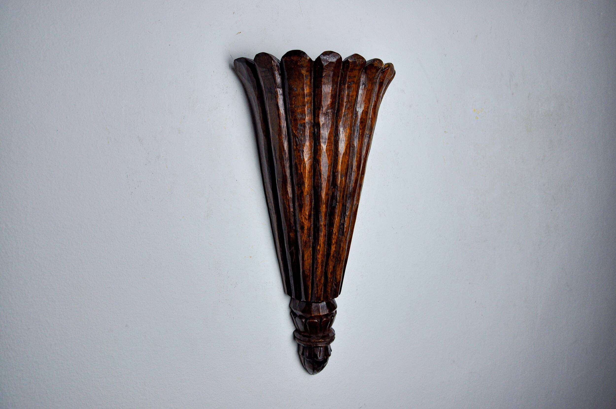 Art Deco wall light in carved wood, France, 1930
