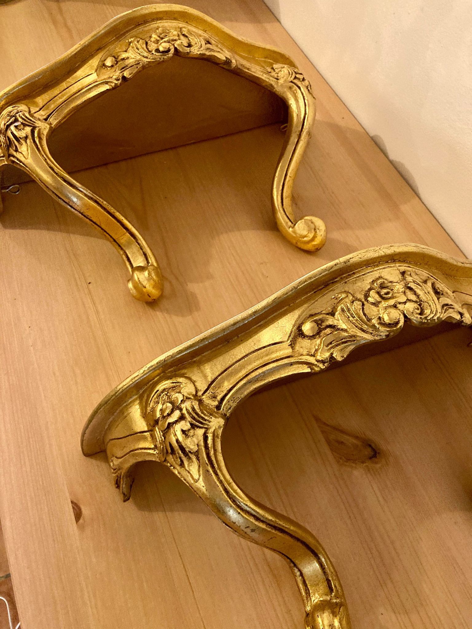 Pair of gilded wall shelves