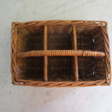 Basket carries glasses or cutlery in wicker.