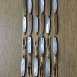 Old brass forks and knives and mother-of-pearl handle
