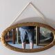 Miroir ovale Art déco en bois doré vers 1920