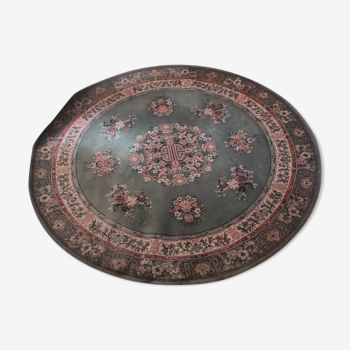 Round carpet floral pattern with a predominantly green