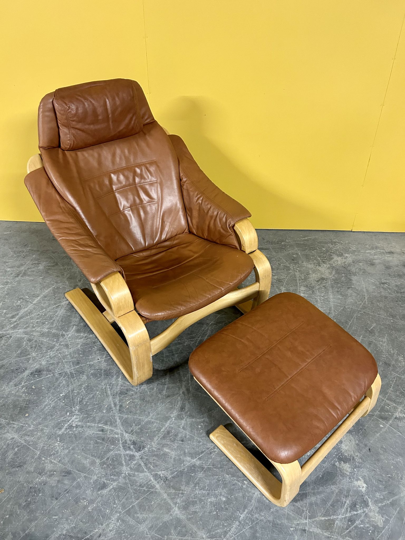 Danish vintage cognac leather armchair and footstool by Skipper Mobler