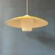 Danish mid-century suspension with opaline glass shade and yellow metal cover.