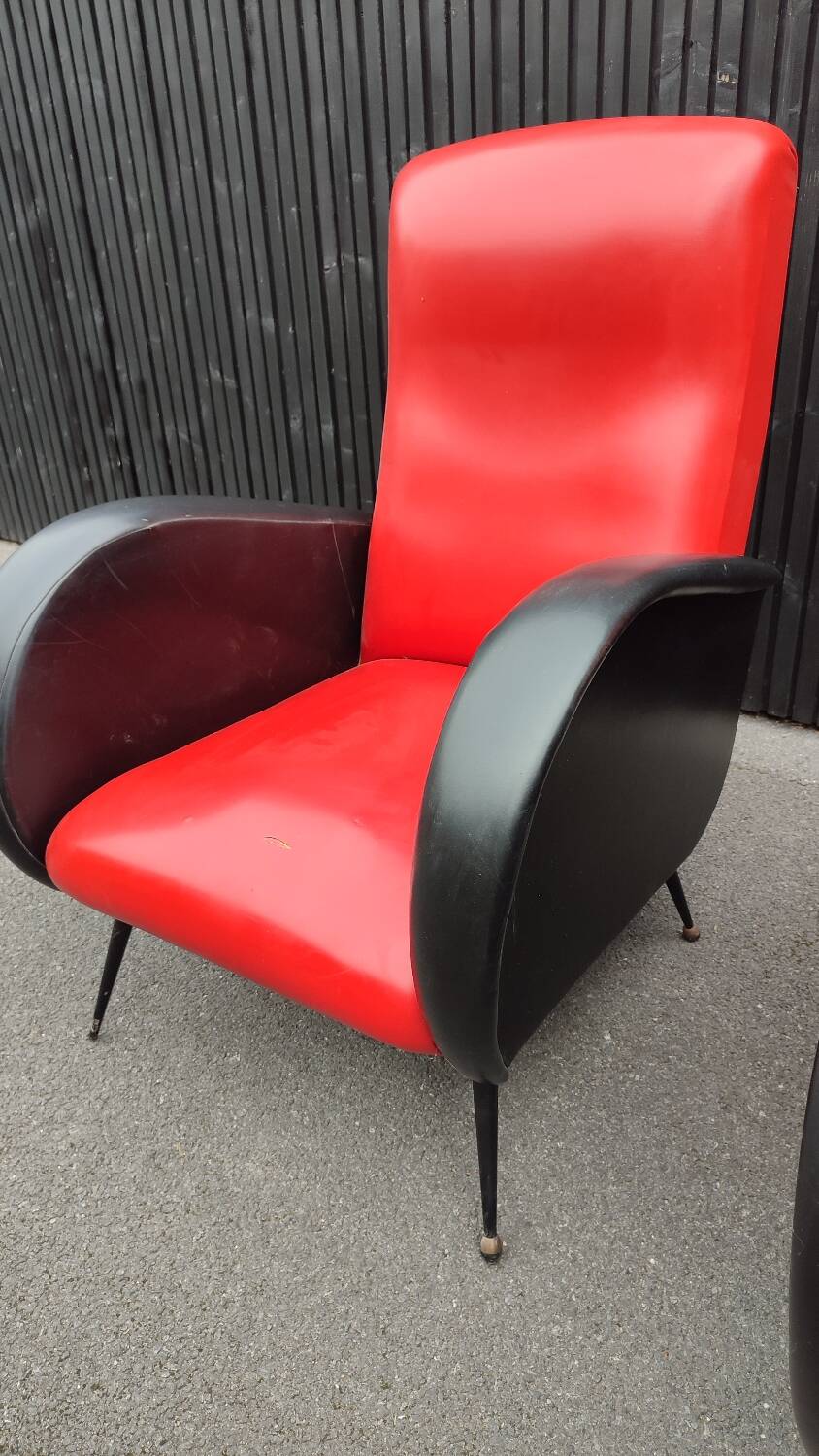 Pair of red and black faux leather armchairs