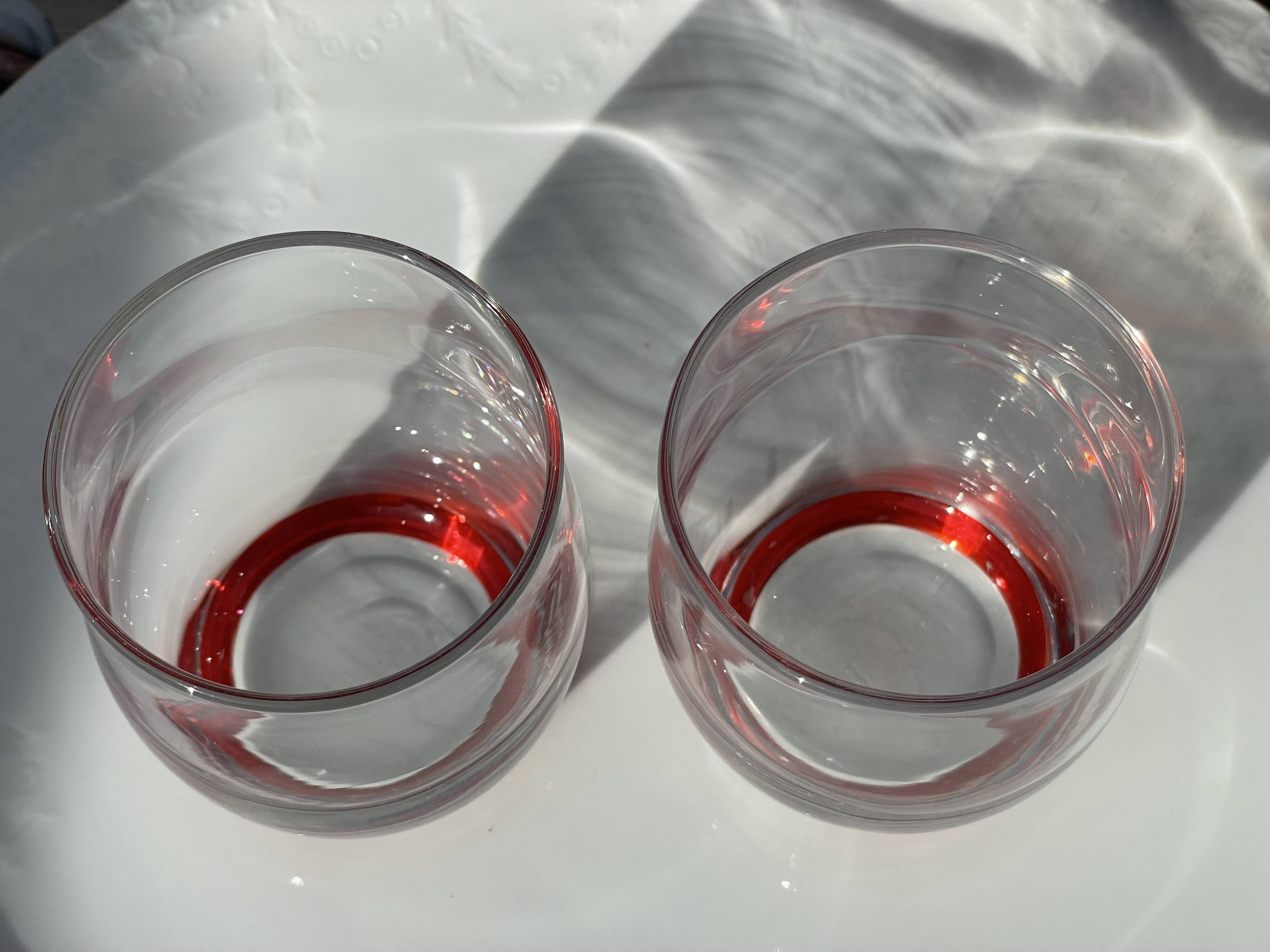 2 glasses with a red background