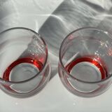 2 glasses with a red background
