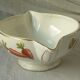 Sauceboat in earthenware decorated with four seasons vegetables.