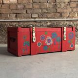 Red wooden trunk with floral patterns
