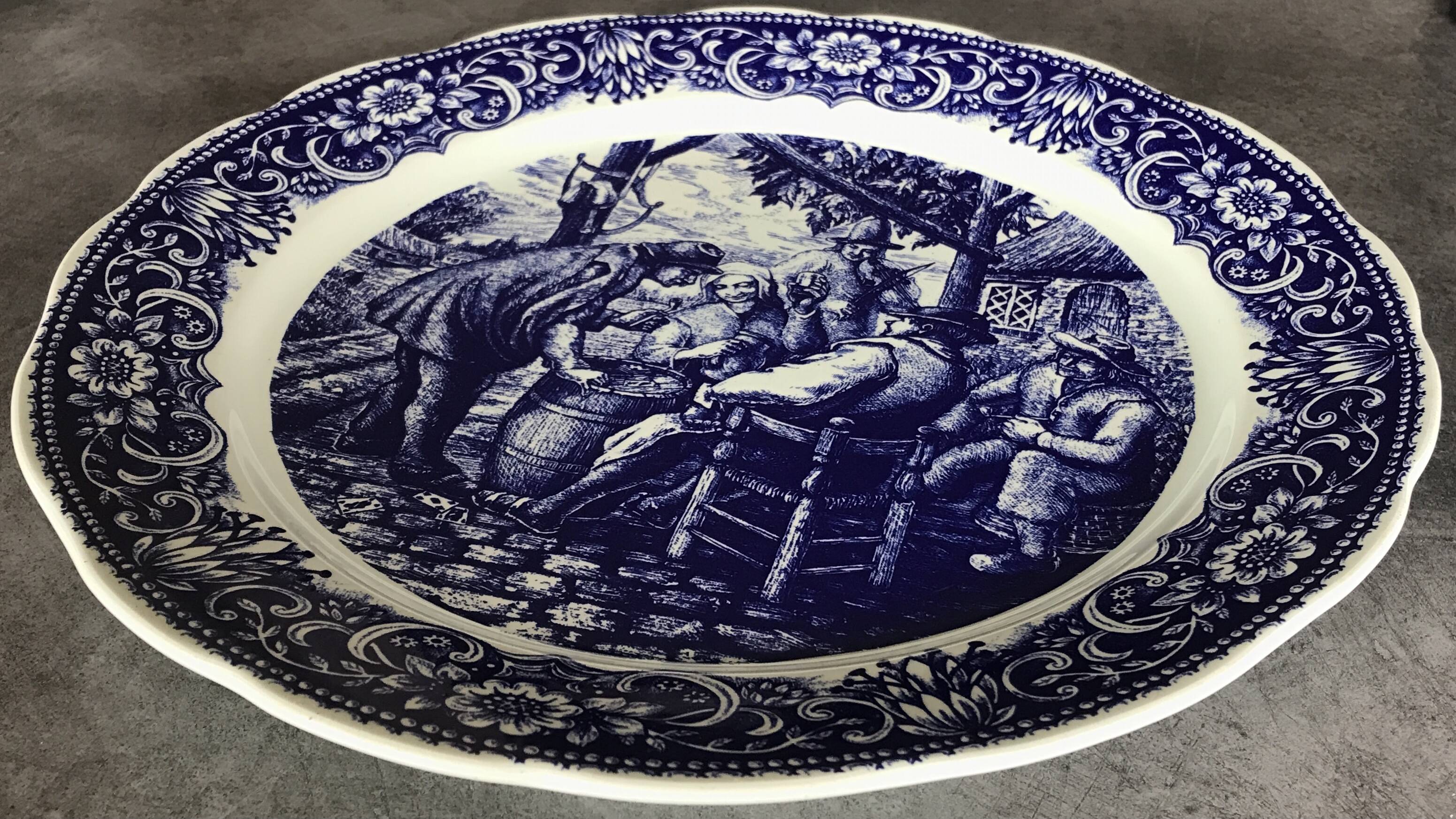 Blue enamelled earthenware wall dish with peasant scene decor Boch La Louvière