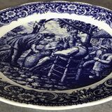 Blue enamelled earthenware wall dish with peasant scene decor Boch La Louvière