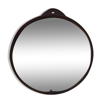 Round mirror covered in vintage saddle stitched leather