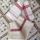 Two mismatched former dishcloths in red and white.