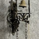 Wrought iron entrance bell depicting a monk ringing a bell circa 1900-1930