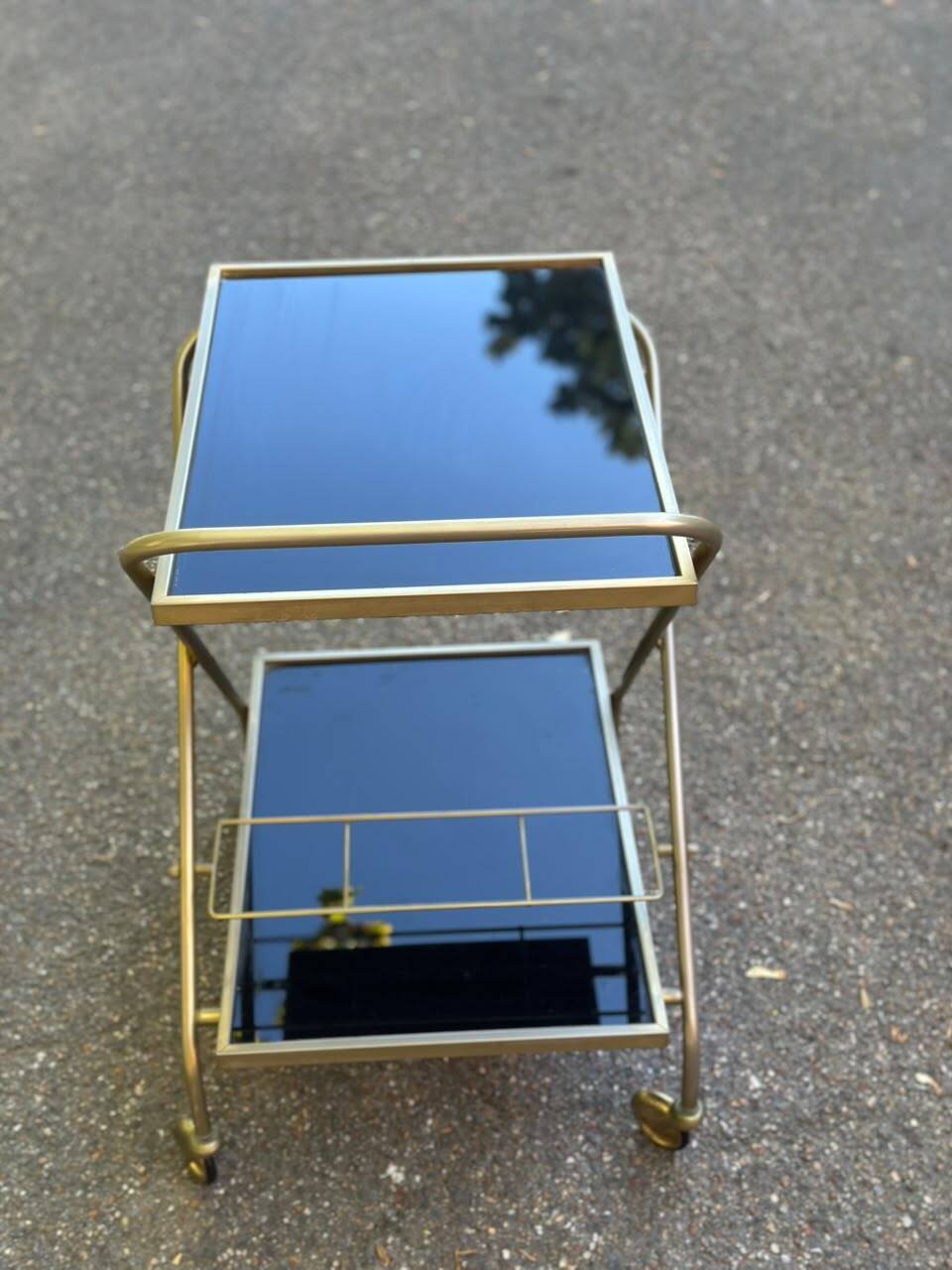 Mid-Century 1978 brass and black smoked glass wheeled dessert trolley.